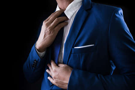 Man in business suit, business man on black backgroundの写真素材