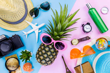 Fashion Pineapple. Bright Summer Color. Beach Clothes Accessories Outfit. Creative Art. Tropical fruit, Stylish Sunglasses. Minimal. Hot Beach Vibes. Party Mood on Yellow. Flat lay.の写真素材