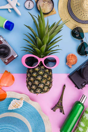 Fashion Pineapple. Bright Summer Color. Beach Clothes Accessories Outfit. Creative Art. Tropical fruit, Stylish Sunglasses. Minimal. Hot Beach Vibes. Party Mood on Yellow. Flat lay.の写真素材