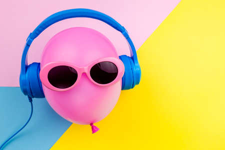 pink air balloon on colorful background, Bright Summer Color, Tropical Fruit with Sunglasses, Creative Art concept. Minimal style,Hot Beach Vibes. Fun Party Moodの写真素材