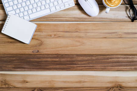 Office desk table of modern workplace with laptop on wooden table, top view laptop background and copy space on wooden background,Flay lay, Top view office table desk with computer laptop,の写真素材