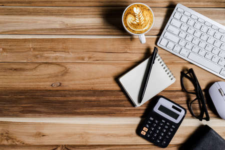Office desk table of modern workplace with laptop on wooden table, top view laptop background and copy space on wooden background,Flay lay, Top view office table desk with computer laptop,の写真素材