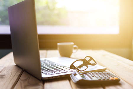 Office desk table of modern workplace with laptop on wooden table, top view laptop background and copy space on wooden background,Flay lay, Top view office table desk with computer laptop,の写真素材