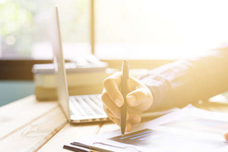 Office desk table of modern workplace with laptop on wooden table, top view laptop background and copy space on wooden background, White desk office with laptop, smartphone and other work supplies on wood desk, laptop backgroundの写真素材