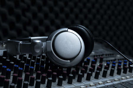 Close-up of boutique recording studio control desk, dj headphones for professional disc,  equipment...