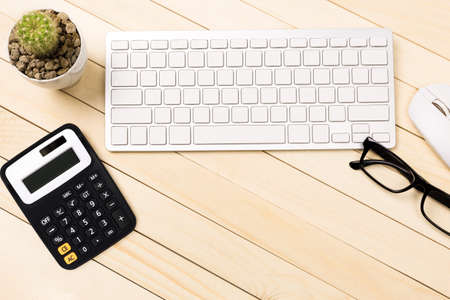 Office desk table of modern workplace with laptop on wooden table, top view laptop background and copy space on wooden background,Flay lay, Top view office table desk with computer laptop,の写真素材