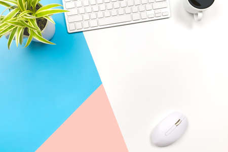 flat lay Office desk table of modern workplace with laptop on blue pink and white background, top view laptop background and copy space on background, blue white and pink desk office with laptop,の写真素材