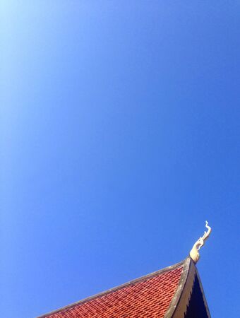 buddhism roof on blue sky.の写真素材