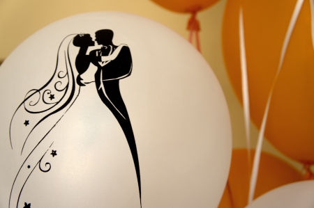 White and orange balloons in a wedding celebrationの写真素材