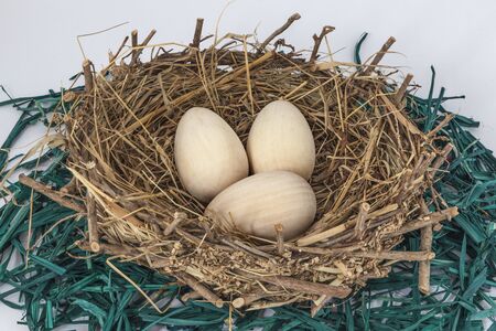 Easter wooden eggs on nestの写真素材