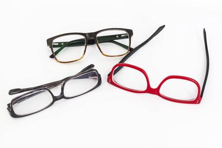 many red and black eyeglasses with white backgroundの写真素材