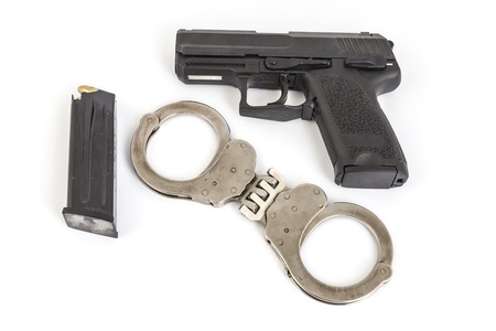 gun and handcuffs with white background