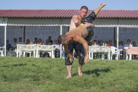HILIA EVROS, GREECE - AUGUST 18:Unidentified wrestlers in the Annual Oil Wrestling Event in HILIA-EVROS on August 18, 2013 in Hilia Evros, Greeceのeditorial素材
