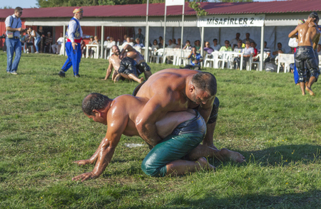 HILIA EVROS, GREECE - AUGUST 18:Unidentified wrestlers in the Annual Oil Wrestling Event in HILIA-EVROS on August 18, 2013 in Hilia Evros, Greeceのeditorial素材