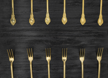 Vintage forks on a black backgroundの写真素材