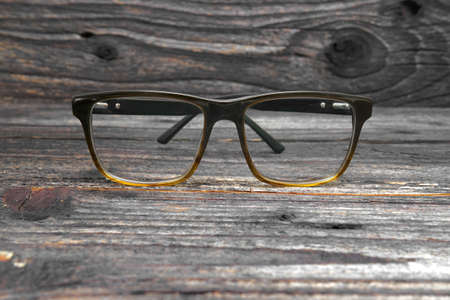 vintage glasses isolated on a wooden background