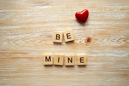 Wooden letters spelling be mine