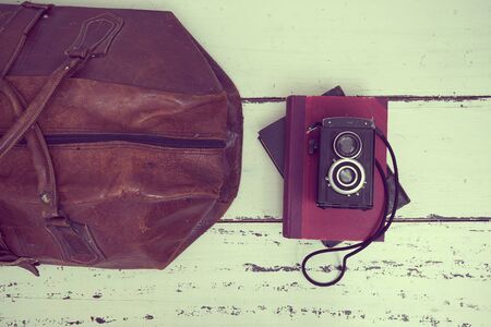 Vintage suitcases with books and cameraの写真素材