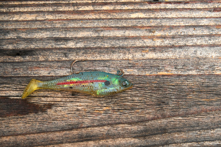 Fishing bait isolated on wooden background