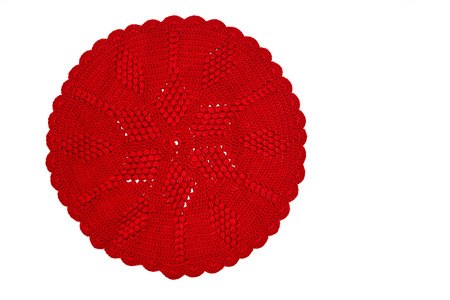 Vintage red knitted doily isolated on white backgroundの写真素材