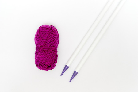 Ball of yarn with knitting needles isolated on white backgroundの写真素材