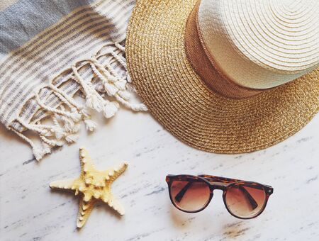 Beach essentials on white marble.の写真素材