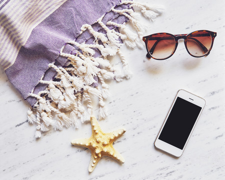 Summer accessories on white marble.の写真素材