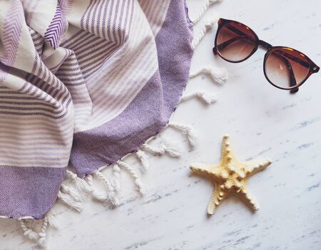 Beach essentials on white marble.の写真素材