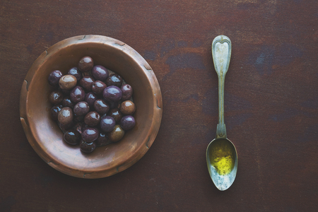 Olive oils and olives in vintage plateの写真素材
