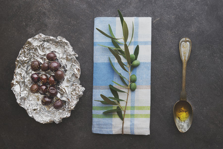 Olives in silver foilの写真素材