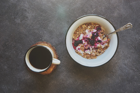 Breakfast with coffee and fruits on black cement backgroundの写真素材
