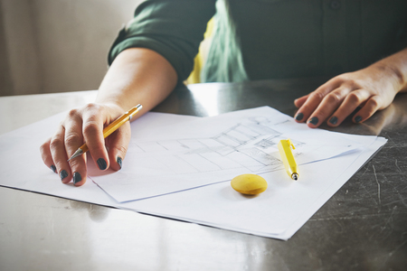 Architect woman sketching in her officeの写真素材