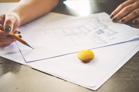 Architect woman sketching in her officeの写真素材