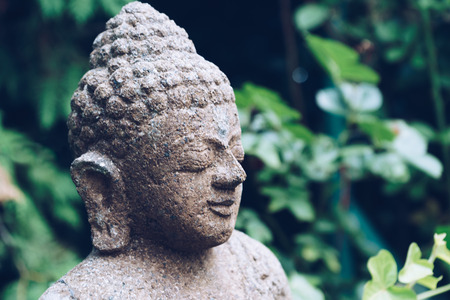 Buddha sculpture on green natureの写真素材