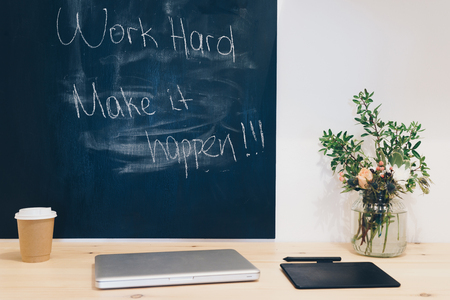 Workplace, study room with table and written blackboard, concept to success.の写真素材