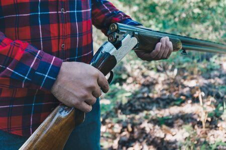 Hunter with a gun  on the forest