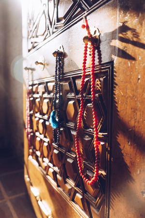 Preyer beads hanging on a door in a mosque on Edirne, Turkeyの写真素材