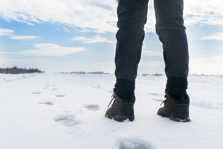 Woman is walking on the snow の写真素材