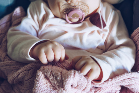 Close up of little baby handsの写真素材