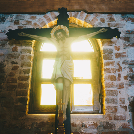 Jesus on the cross in a churchの写真素材