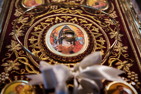 Wedding crowns and rings on the holly bible, prepared for ceremonyの写真素材