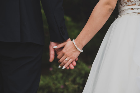 Young married couple holding handsの写真素材