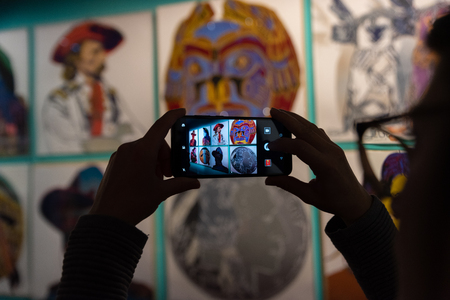Rome, Italy - November 10 2018: Woman take photo of Andy Warhol exhibition