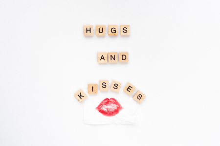 Hugs and kisses words on white marble backgroundの写真素材