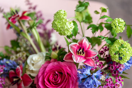 Beautiful bouquet of bright flowers in basketの写真素材