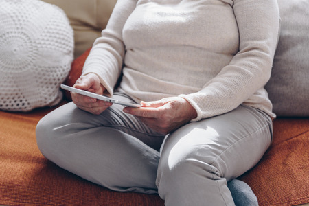 Senior woman using tabletの写真素材