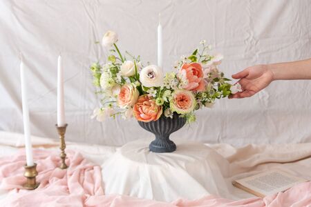 Woman hands touching  a bouquet of flowers.の写真素材