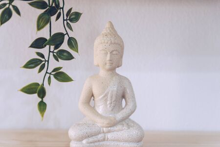 White Buddha isolated in white backgroundの写真素材