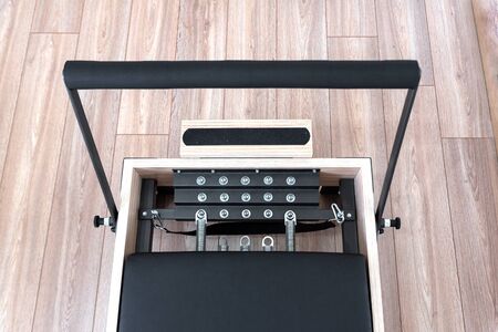 Pilates reformer  bed for fitness workouts in gymの写真素材