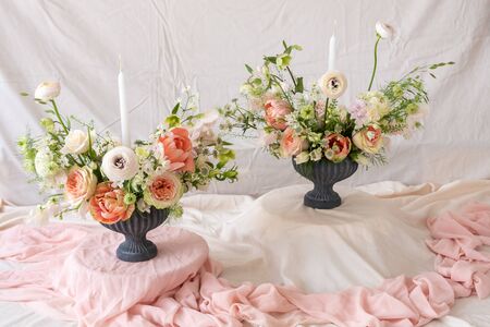 Still life with  beautiful bouquets of flowers and candlesの写真素材